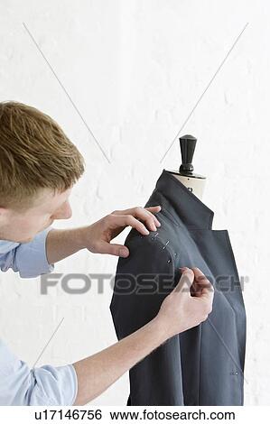 Tailor pinning sleeve to jacket View Large Photo Image Stock Photograph - Tailor pinning sleeve to jacket. Fotosearch