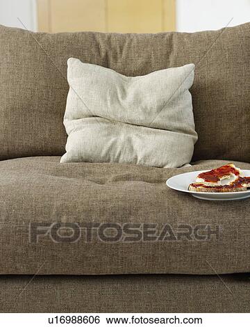 Toast with jam on plate on sofa View Large Photo Image Stock Photograph - Toast with jam on plate on sofa. Fotosearch