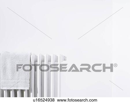Towel on radiator and white wall View Large Photo Image Stock Photo - Towel on radiator and white wall. Fotosearch