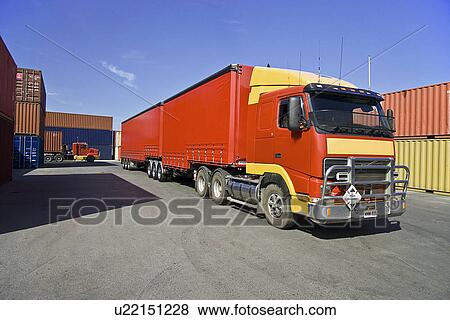 Truck and cargo containers at port View Large Photo Image Stock Photo - Truck and cargo containers at port. Fotosearch