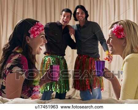 Two couples at dressing up party View Large Photo Image Stock Image - Two couples at dressing up party. Fotosearch