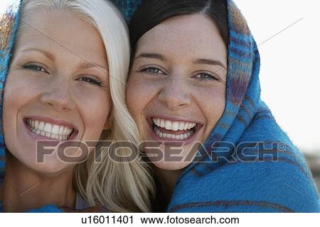 Two women smiling portrait View Large Photo Image Stock Image - Two women smiling portrait. Fotosearch
