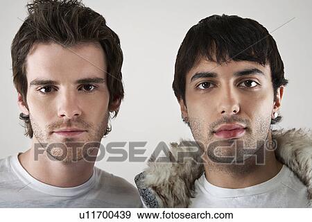 Two young men side by side portrait close-up View Large Photo Image Stock Photo - Two young men side by side portrait close-up. Fotosearch