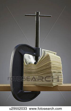Vise gripping stack of banknotes View Large Photo Image Stock Image - Vise gripping stack of banknotes. Fotosearch