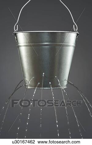 Water leaking from bucket View Large Photo Image Stock Image - Water leaking from bucket. Fotosearch