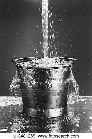 Water Pouring in Bucket View Large Photo Image Stock Photo - Water Pouring in Bucket. Fotosearch