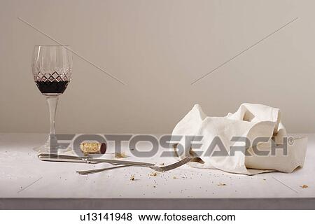 Wine glass cutlery dish cloth on messy table View Large Photo Image Stock Photo - Wine glass cutlery dish cloth on messy table. Fotosearch
