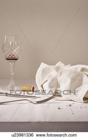 Wine glass cutlery dish cloth on messy table View Large Photo Image Stock Photograph - Wine glass cutlery dish cloth on messy table. Fotosearch