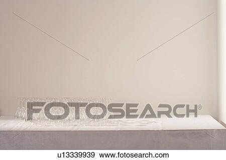 Wine glasses on table View Large Photo Image Stock Photo - Wine glasses on table. Fotosearch