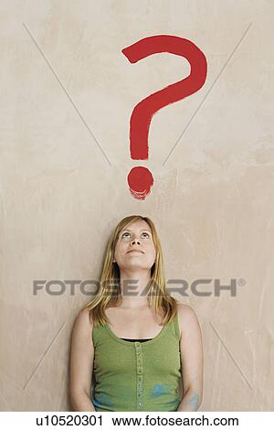 Woman leaning against wall with painted question mark View Large Photo Image Stock Image - Woman leaning against wall with painted question mark. Fotosearch