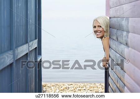 Woman leaning out of beach house verandah portrait View Large Photo Image Stock Photograph - Woman leaning out of beach house verandah portrait. Fotosearch