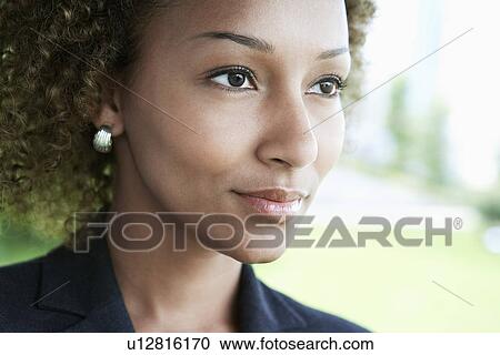 Woman outdoors looking away close-up View Large Photo Image Stock Image - Woman outdoors looking away close-up. Fotosearch