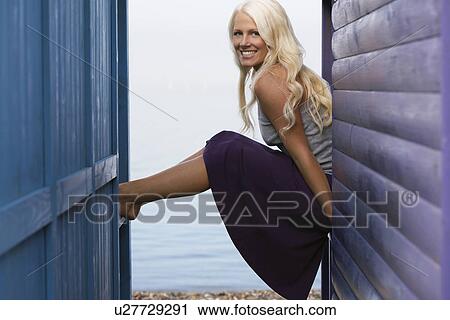 Woman sitting on balustrades of beach house verandahs portrait View Large Photo Image Stock Image - Woman sitting on balustrades of beach house verandahs portrait. Fotosearch