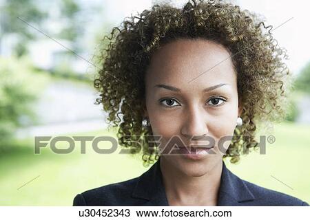 Woman smiling outdoors close-up portrait View Large Photo Image Stock Image - Woman smiling outdoors close-up portrait. Fotosearch