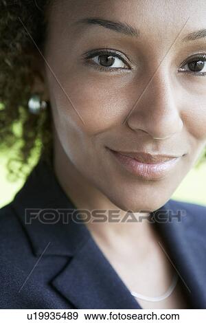 Woman smiling outdoors close-up portrait View Large Photo Image Stock Photo - Woman smiling outdoors close-up portrait. Fotosearch