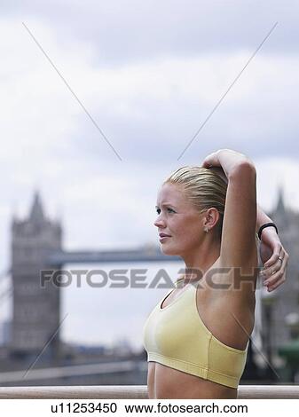Woman stretching in front of Tower Bridge England London View Large Photo Image Stock Image - Woman stretching in front of Tower Bridge England London. Fotosearch