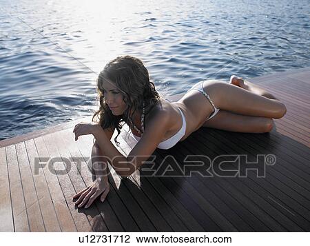 Woman Sunbathing on Yacht View Large Photo Image Stock Image - Woman Sunbathing on Yacht. Fotosearch