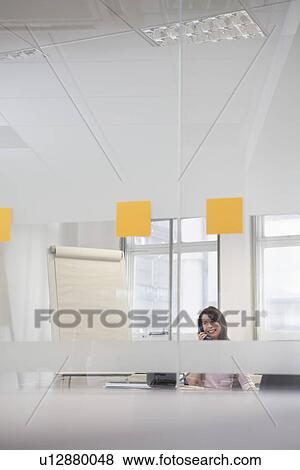 Woman working in office View Large Photo Image Stock Photo - Woman working in office. Fotosearch