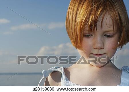 Young girl (5-6) at ocean close-up portrait View Large Photo Image Stock Photograph - Young girl (5-6) at ocean close-up portrait. Fotosearch