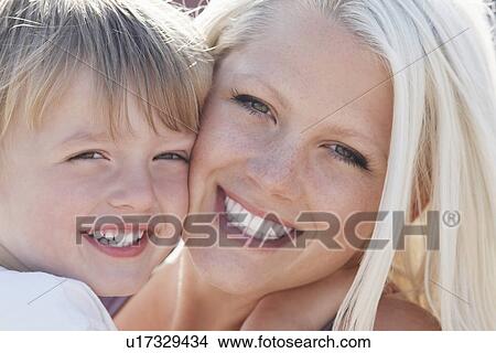 Young mother and son (3-4) close-up View Large Photo Image Picture - Young mother and son (3-4) close-up. Fotosearch