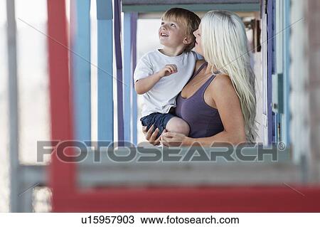 Young mother with son (3-4) on outdoor porch View Large Photo Image Stock Image - Young mother with son (3-4) on outdoor porch. Fotosearch