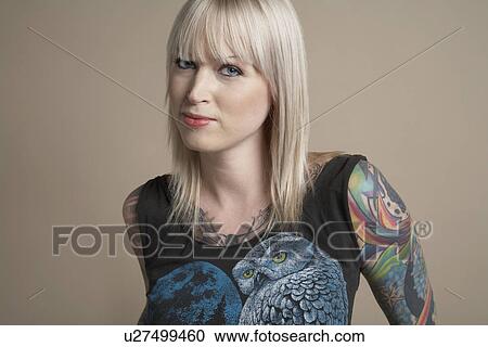 Young tattooed woman portrait View Large Photo Image Stock Image - Young tattooed woman portrait. Fotosearch