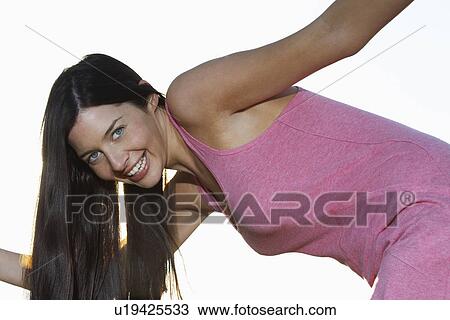 Young woman bending down View Large Photo Image Stock Image - Young woman bending down. Fotosearch