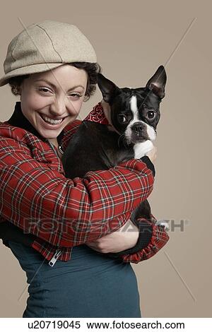 Young woman holding French Bulldog View Large Photo Image Stock Photography - Young woman holding French Bulldog. Fotosearch