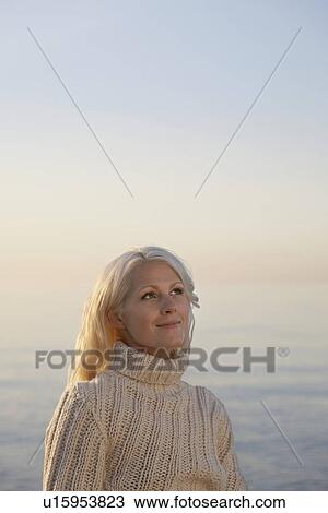 Young woman on beach portrait View Large Photo Image Stock Image - Young woman on beach portrait. Fotosearch