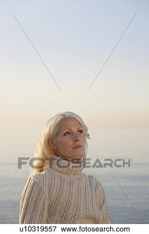 Young woman on beach portrait View Large Photo Image Stock Photo - Young woman on beach portrait. Fotosearch