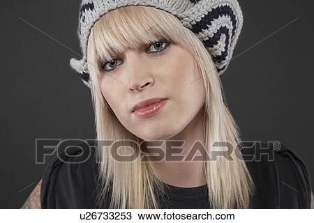 Young woman wearing cap portrait close-up View Large Photo Image Stock Image - Young woman wearing cap portrait close-up. Fotosearch