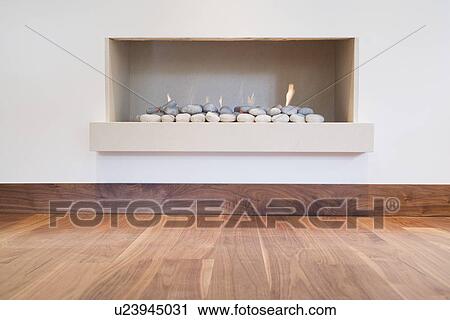 A detail of a modern simple fireplace View Large Photo Image Stock Image - A detail of a modern simple fireplace. Fotosearch