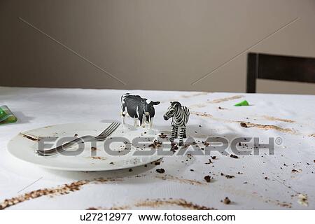 Animal figurines on messy table View Large Photo Image Stock Photo - Animal figurines on messy table. Fotosearch