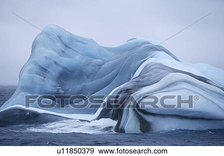 Stock Photo - Antarctica Scotia Sea iceberg in water. Fotosearch
