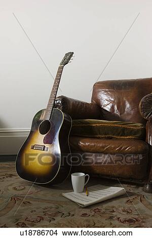 Picture - Armchair and guitar. Fotosearch