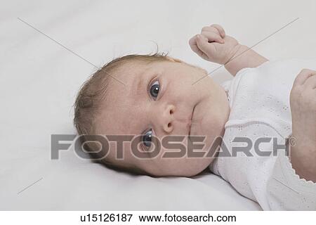 Baby boy lying down View Large Photo Image Stock Photo - Baby boy lying down. Fotosearch