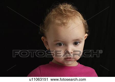 Baby girl (1-2) on black background close-up View Large Photo Image Stock Image - Baby girl (1-2) on black background close-up. Fotosearch