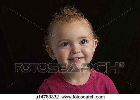 Baby girl (1-2) on black background close-up View Large Photo Image Stock Image - Baby girl (1-2) on black background close-up. Fotosearch