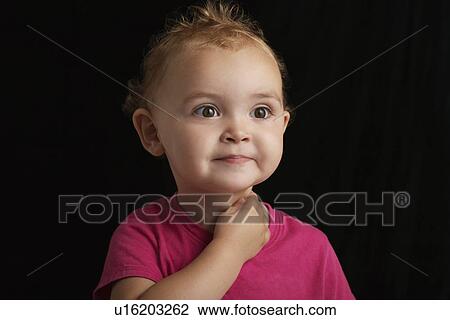 Baby girl (1-2) on black background close-up View Large Photo Image Stock Image - Baby girl (1-2) on black background close-up. Fotosearch