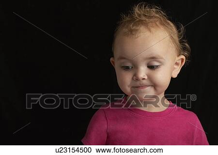 Baby girl (1-2) on black background close-up View Large Photo Image Stock Image - Baby girl (1-2) on black background close-up. Fotosearch