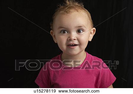 Baby girl (1-2) on black background close-up View Large Photo Image Stock Photo - Baby girl (1-2) on black background close-up. Fotosearch
