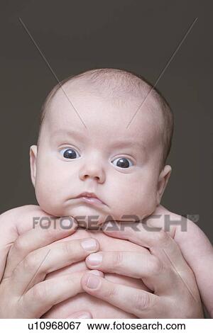Stock Photo - Baby girl making face. Fotosearch