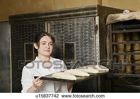Baker Carrying Loaves of Bread Dough to Bake View Large Photo Image Stock Image - Baker Carrying Loaves of Bread Dough to Bake. Fotosearch