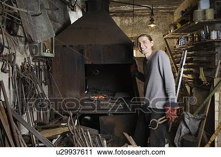 Blacksmith Standing by Forge View Large Photo Image Stock Image - Blacksmith Standing by Forge. Fotosearch