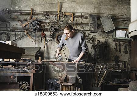 Blacksmith Working in Shop View Large Photo Image Stock Image - Blacksmith Working in Shop. Fotosearch