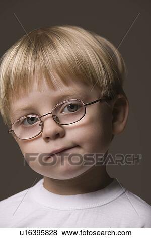 Blonde-haired boy wearing glasses View Large Photo Image Stock Photo - Blonde-haired boy wearing glasses. Fotosearch