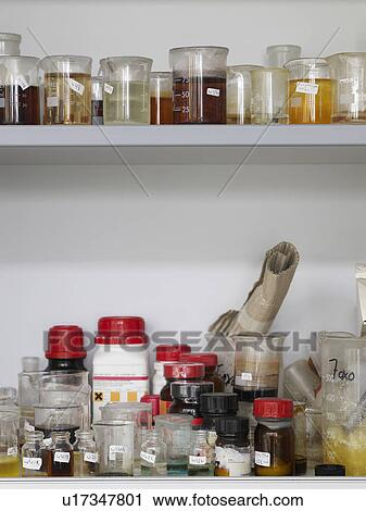 Bottles and lab flasks on shelves View Large Photo Image Stock Image - Bottles and lab flasks on shelves. Fotosearch