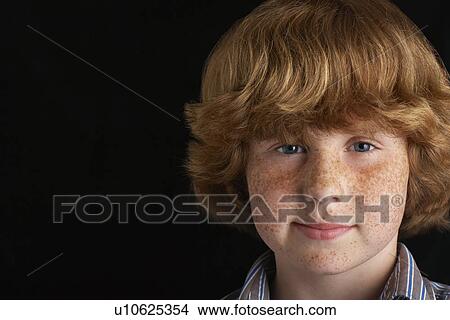 Boy (10-12) on black background portrait close-up View Large Photo Image Picture - Boy (10-12) on black background portrait close-up. Fotosearch