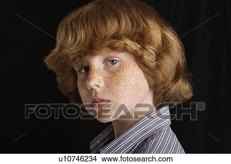 Boy (10-12) on black background portrait close-up View Large Photo Image Picture - Boy (10-12) on black background portrait close-up. Fotosearch