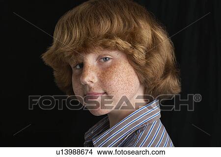 Boy (10-12) on black background portrait close-up View Large Photo Image Picture - Boy (10-12) on black background portrait close-up. Fotosearch